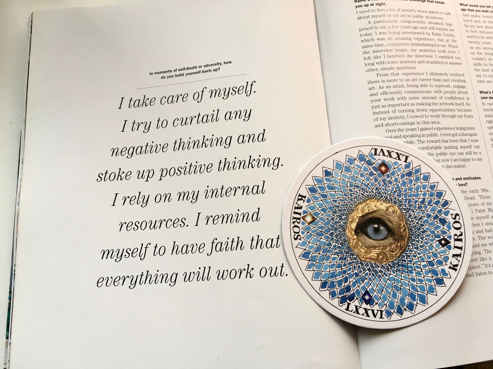 page of large book opened to large type quote on left page (read below) and circular Kairos card with blue prism-like design with furry animal eye cut out in center of card